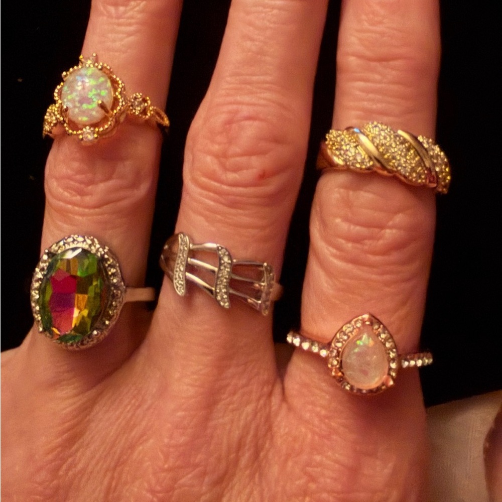 Lot of five rings. 1 size 8. 2 size 7. 1 size 9. 1 adjustable.  get 50% off.